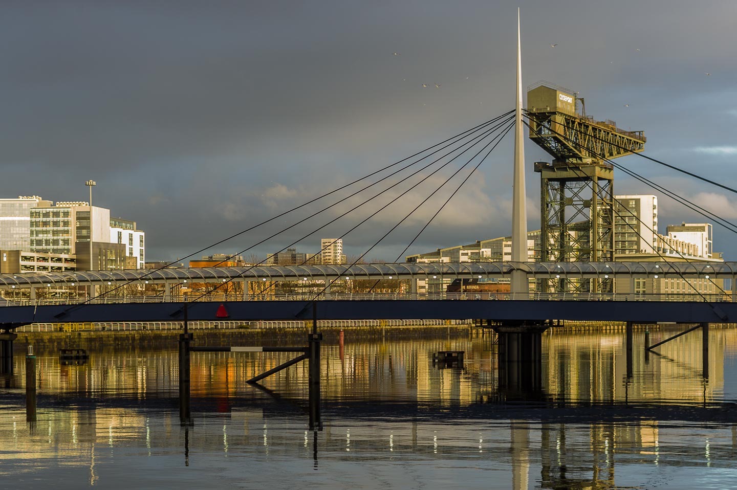 BELL'S BRIDGE
An extraordinary, and slightly menacing, lighting effect as the low afternoon sun cuts through below the clouds, illuminating the bridge, the Finneston Crane and buildings on the north bank of the Clyde