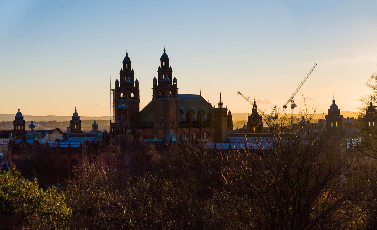 KELVINGROVE SUNSET
Late afternoon light can be fantastic to behold in autumn in Glasgow, and here the domes of Kelvingrove Gallery and the Kelvin Hall jostle with the silhouettes of cranes in the gloaming